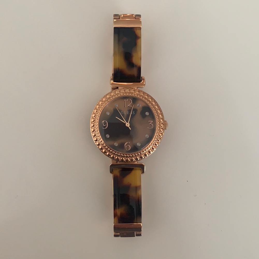 GUESS a women’s watch- Rose gold and tortoise shell